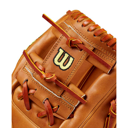 Close-up of a Wilson A2000 1786 11.5" Baseball Glove (WBW102073115) in tan Pro Stock leather with brown laces and a gold and black W logo stitched on the webbing.