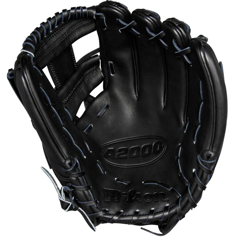 A Wilson A2000 1975 11.75" Baseball Glove (WBW1020741175) in black leather with blue stitching is shown from the palm side, highlighting Pro Stock leather, the Wilson brand name, and detailed webbing.
