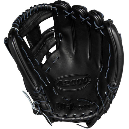 A Wilson A2000 1975 11.75" Baseball Glove (WBW1020741175) in black leather with blue stitching is shown from the palm side, highlighting Pro Stock leather, the Wilson brand name, and detailed webbing.