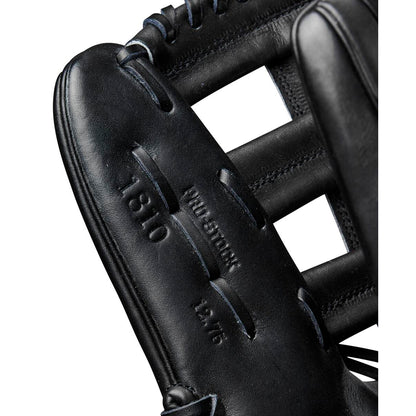 Close-up of a black Wilson A2000 1810 12.75" baseball glove showing detailed stitching and embossed Wilson branding. The glove’s webbing and part of the fingers are also visible.