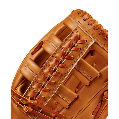 Close-up of a Wilson A2000 1810 12.75" Baseball Glove: WBW1020901275, made from Pro Stock leather, showing brown color, detailed stitching, and laces against a white background.