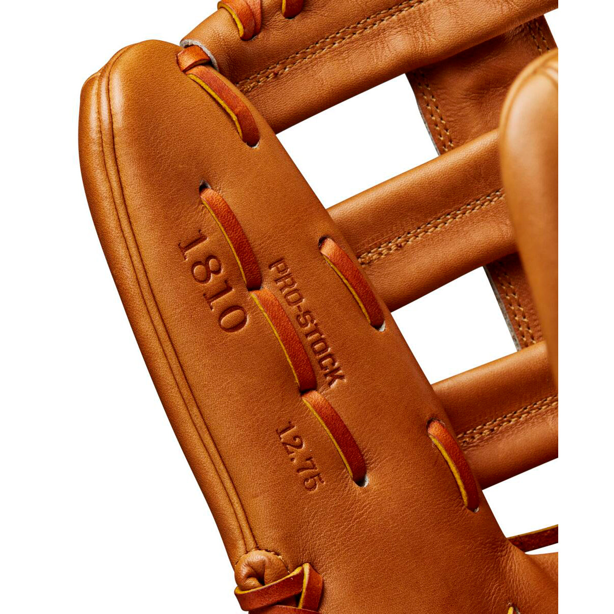 Close-up of a tan Wilson A2000 1810 12.75" Baseball Glove, showing detailed stitching, laces, and embossed text on premium Pro Stock leather for lasting performance. Model: WBW1020901275.