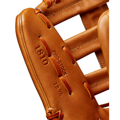 Close-up of a tan Wilson A2000 1810 12.75" Baseball Glove, showing detailed stitching, laces, and embossed text on premium Pro Stock leather for lasting performance. Model: WBW1020901275.