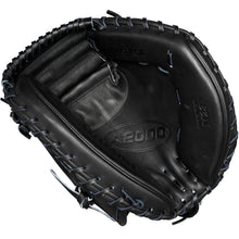 A Wilson A2000 M23 33.5" Baseball Catcher's Mitt (WBW102092335) is shown from above, highlighting its black Pro Stock leather, visible stitching, embossed Wilson branding, deep pocket, and webbing details.