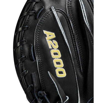 Close-up of a Wilson A2000 M23 33.5" Catcher’s Mitt (WBW102092335) in black with yellow A2000 embroidery and white stitching, showcasing the Pro Stock leather texture and detailed laces.