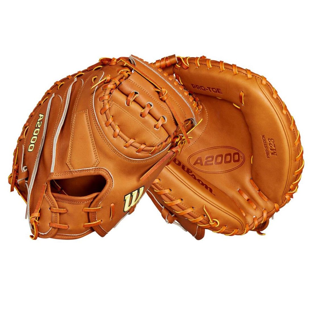 Two tan Wilson A2000 M23 33.5" Baseball Catcher's Mitts (WBW102094335) are shown from different angles, highlighting their Pro Stock leather construction, front pocket, and back webbing.