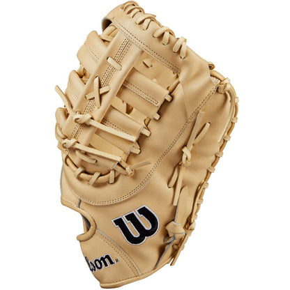 The Wilson A2000 1679 12.5" First Base Mitt (WBW102097125) features tan Pro Stock leather, detailed webbing and stitching, black W logo on the side, and tan laces. Shown from the thumb side to highlight its premium design.