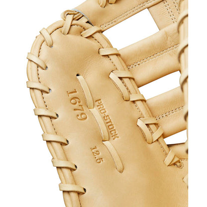Close-up of the Wilson A2000 1679 12.5" Baseball First Base Mitt (WBW102097125) displays tan Pro Stock leather, detailed stitching, and embossed text “1679,” “PRO STOCK,” and “12.5” on the palm, highlighting Wilson craftsmanship.