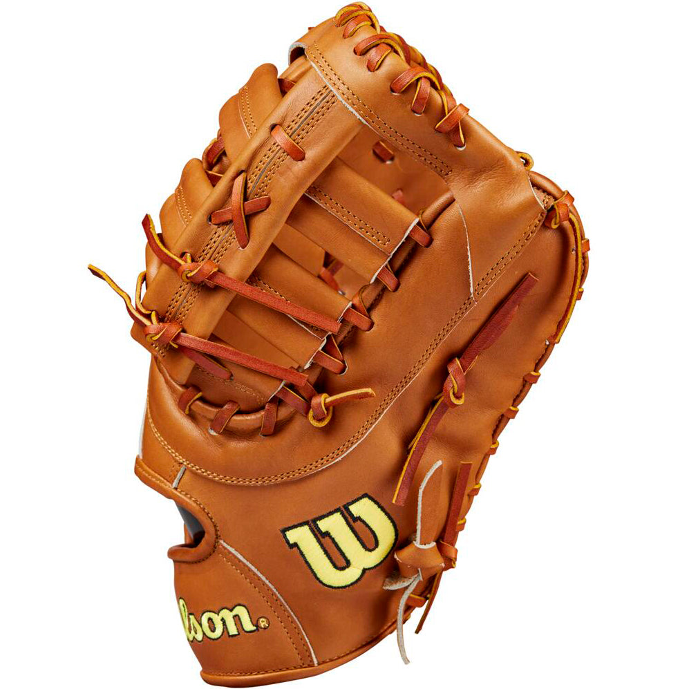 The Wilson A2000 1679 12.5" Baseball First Base Mitt (WBW102099125) features tan Pro Stock leather, brown laces, and yellow Wilson branding on the thumb and wrist, with open webbing and detailed stitching.