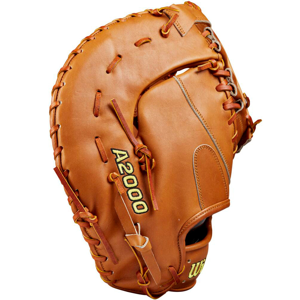 The Wilson A2000 1679 12.5" Baseball First Base Mitt: WBW102099125 by Wilson stands upright, showcasing its brown Pro Stock leather construction, visible stitching, and laces with the palm side in view.