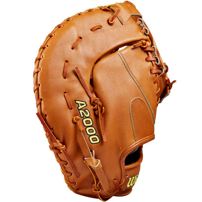 The Wilson A2000 1679 12.5" Baseball First Base Mitt: WBW102099125 by Wilson stands upright, showcasing its brown Pro Stock leather construction, visible stitching, and laces with the palm side in view.