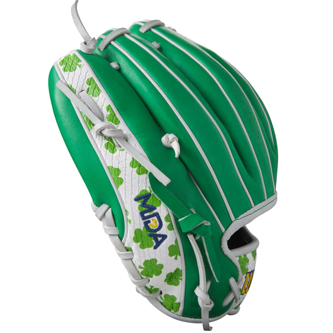 The Wilson A2000 1786 11.5" MDA Shamrocks Baseball Glove features a green and white design with clover patterns, gray laces, blue/yellow/green MPA embroidery, and premium Pro Stock leather for lasting performance.