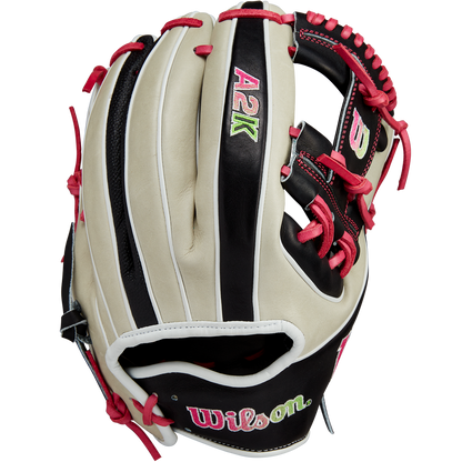 The Wilson A2K 1724 11.75" Baseball Glove (GOTM June 2024: WBW1022571175) features cream and black Pro Stock Select leather, red laces and stitching, colorful embroidered logos, and is part of the exclusive Wilson Glove of the Month series.