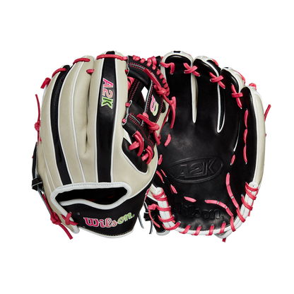 Two Wilson A2K 1724 11.75" GOTM June 2024 baseball gloves by Wilson, made with Pro Stock Select leather in black, beige, and pink, feature white/pink laces and green/pink embroidered logos. Front and back views shown.