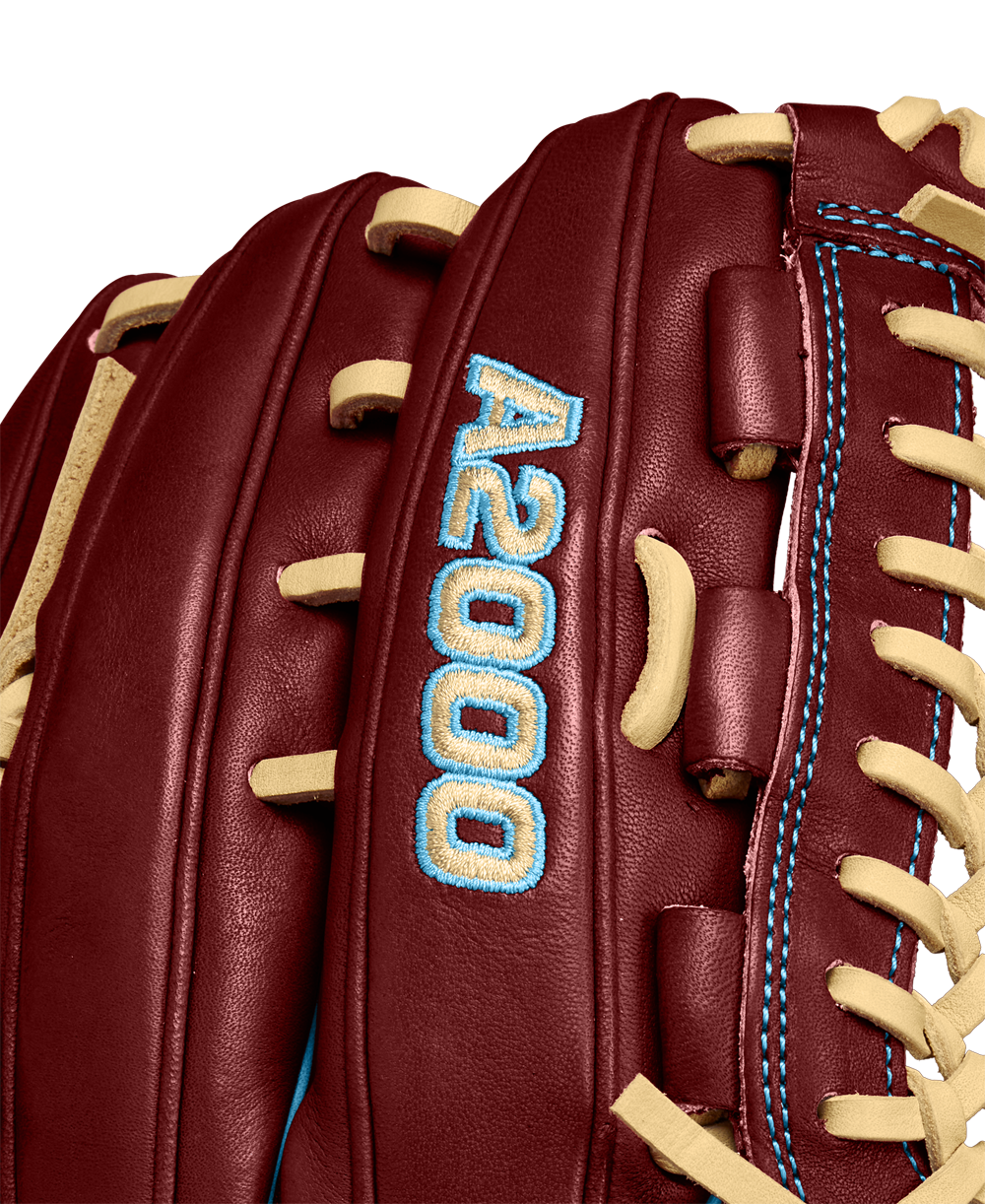 Close-up of a Wilson A2000 D33 11.75" baseball glove (Winter 2024), maroon Pro Stock leather with tan laces, blue stitching, and “A2000” embroidered in blue on the side.
