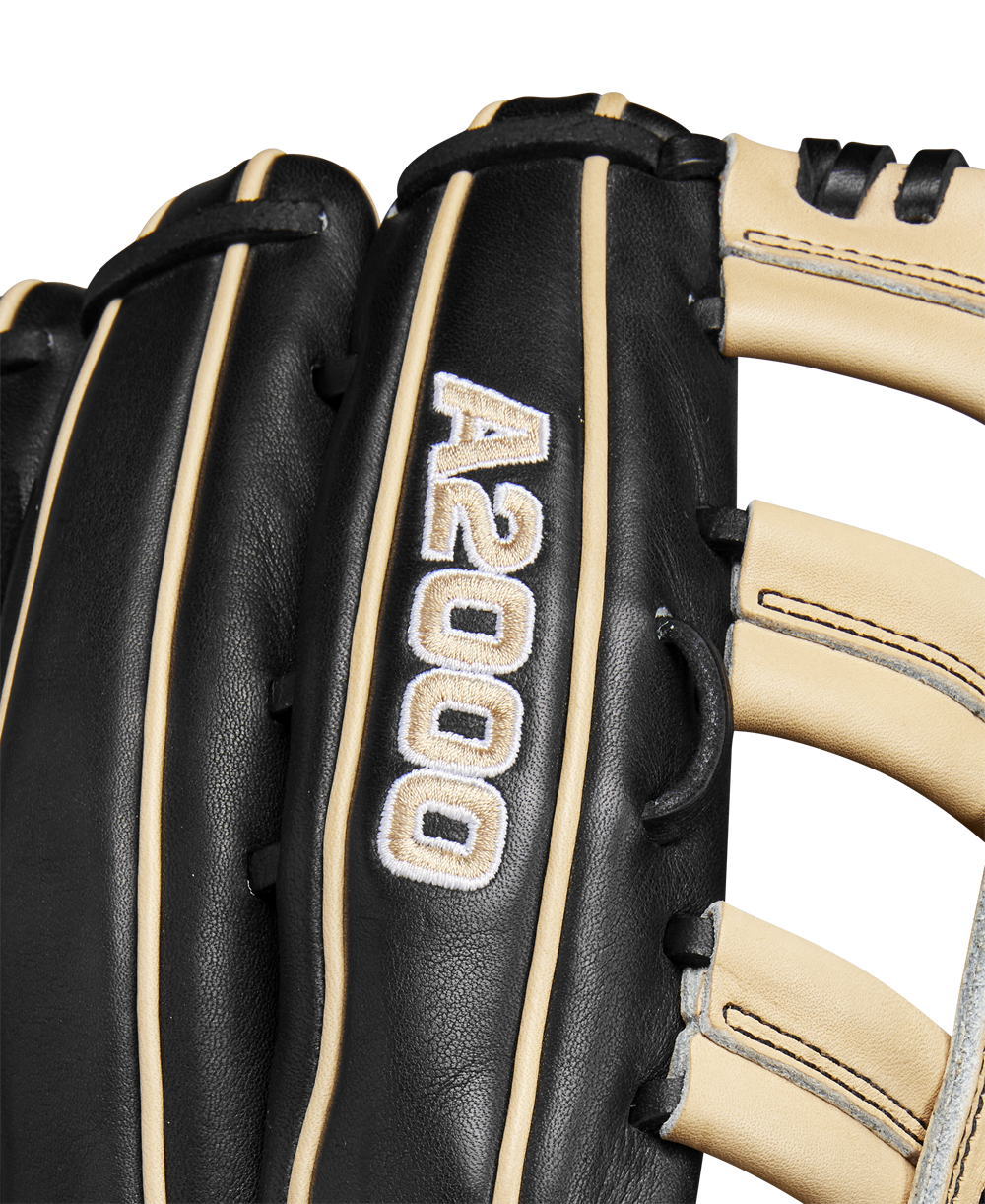 Close-up of the Wilson A2000 1810 12.75" Baseball Glove, Winter 2024 model (WBW1025271275), black and tan with white stitching, made from premium Pro Stock leather, featuring embroidered details and finely crafted laces.