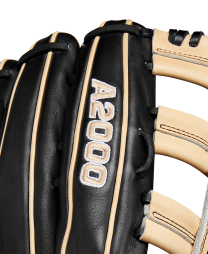 Close-up of the Wilson A2000 1810 12.75" Baseball Glove, Winter 2024 model (WBW1025271275), black and tan with white stitching, made from premium Pro Stock leather, featuring embroidered details and finely crafted laces.