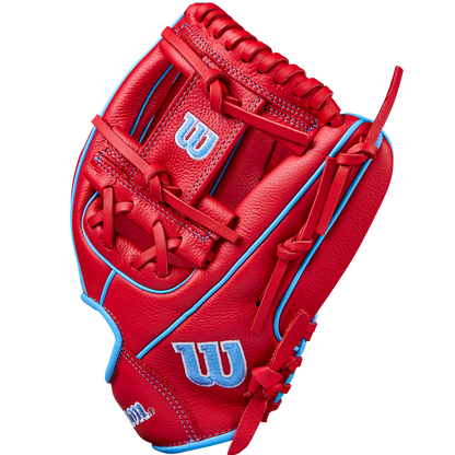 A Wilson A500 11.5" Baseball Glove (WBW102540115) in bright red with light blue accents and stitching, displaying the classic Wilson “W” logo in blue and white on the thumb and wrist, is shown upright against a plain background.