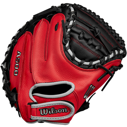 A Wilson A500 32" Baseball Catcher's Mitt (WBW10254632) in red and black with white lacing is shown from the front, displaying the Wilson brand name and webbing details.