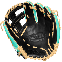 The Wilson A2000 1716SS 11.5" Baseball Glove (SPRING 2025: WBW102547115) features black premium Pro Stock leather, tan laces, turquoise accents, and an embossed Wilson logo on the palm side.