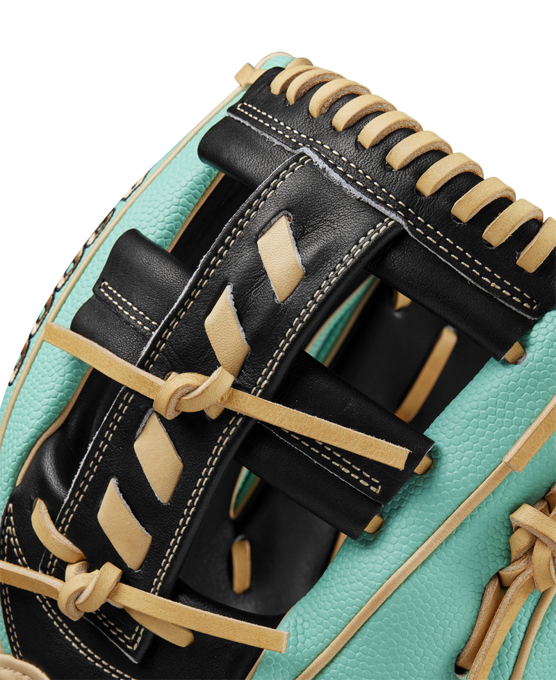 Close-up of the Wilson A2000 1716SS 11.5" Baseball Glove (SPRING 2025: WBW102547115) featuring turquoise Pro Stock leather, black and tan lacing, and detailed stitching that showcases the glove’s quality craftsmanship.