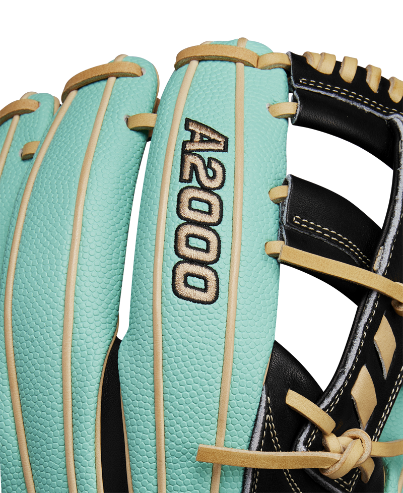 Close-up of the Wilson A2000 1716SS 11.5" Baseball Glove (WBW102547115), featuring turquoise and tan Pro Stock leather, black and gold A2000 embroidery, black laces, and visible stitching. Brand: Wilson. Spring 2025 release.