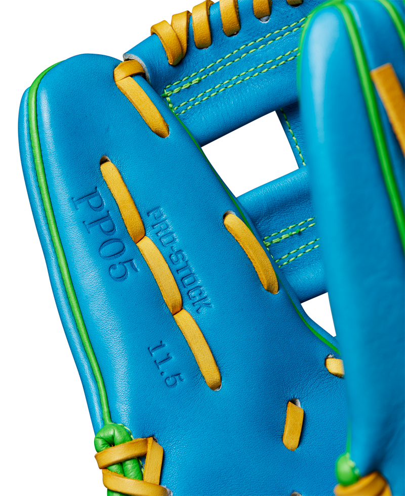 Close-up of the Wilson A2000 PP05 11.5" Baseball Glove (WBW102548115), featuring Pro Stock® leather, yellow laces, green stitching, and embossed text: PP05, PRO STOCK, and 11.5 on the palm.