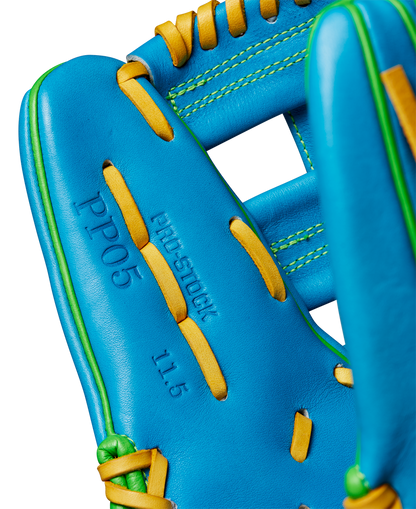 Close-up of the Wilson A2000 PP05 11.5" Baseball Glove (WBW102548115), featuring Pro Stock® leather, yellow laces, green stitching, and embossed text: PP05, PRO STOCK, and 11.5 on the palm.