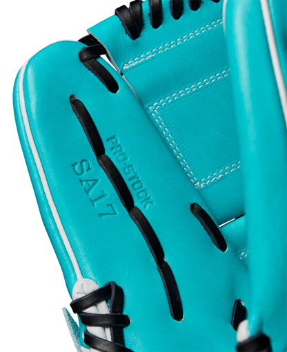 A close-up of the Wilson A2000 SA17 12" Baseball Glove features teal Pro Stock® leather, black laces, and white stitching. PRO STOCK and SA17 are embossed on the palm, showcasing Wilson’s quality craftsmanship. SPRING 2025: WBW10255012.