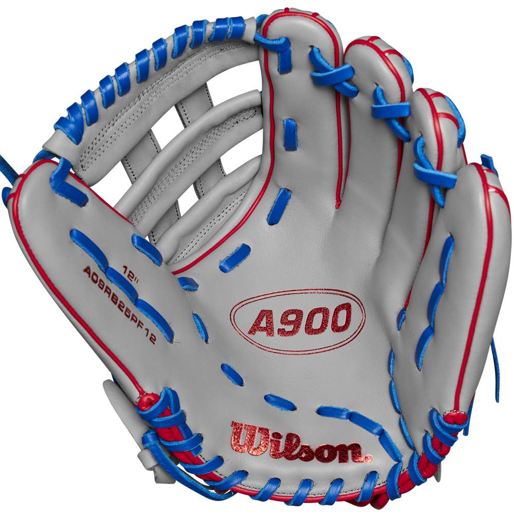 The Wilson A900 PF12 12" Baseball Glove: WBW10257112 features red and blue stitching, Pedroia Fit for a snug feel, and Wilson branding on the palm. Shown open against a plain background.