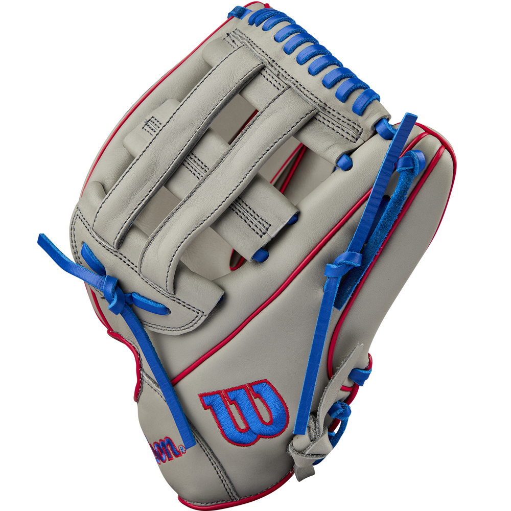 The Wilson A900 PF12 12" Baseball Glove: WBW10257112 features a grey design with blue lacing, red accents, and the Wilson W logo on the thumb. Its Pedroia Fit makes it ideal for youth baseball players seeking comfort and performance.