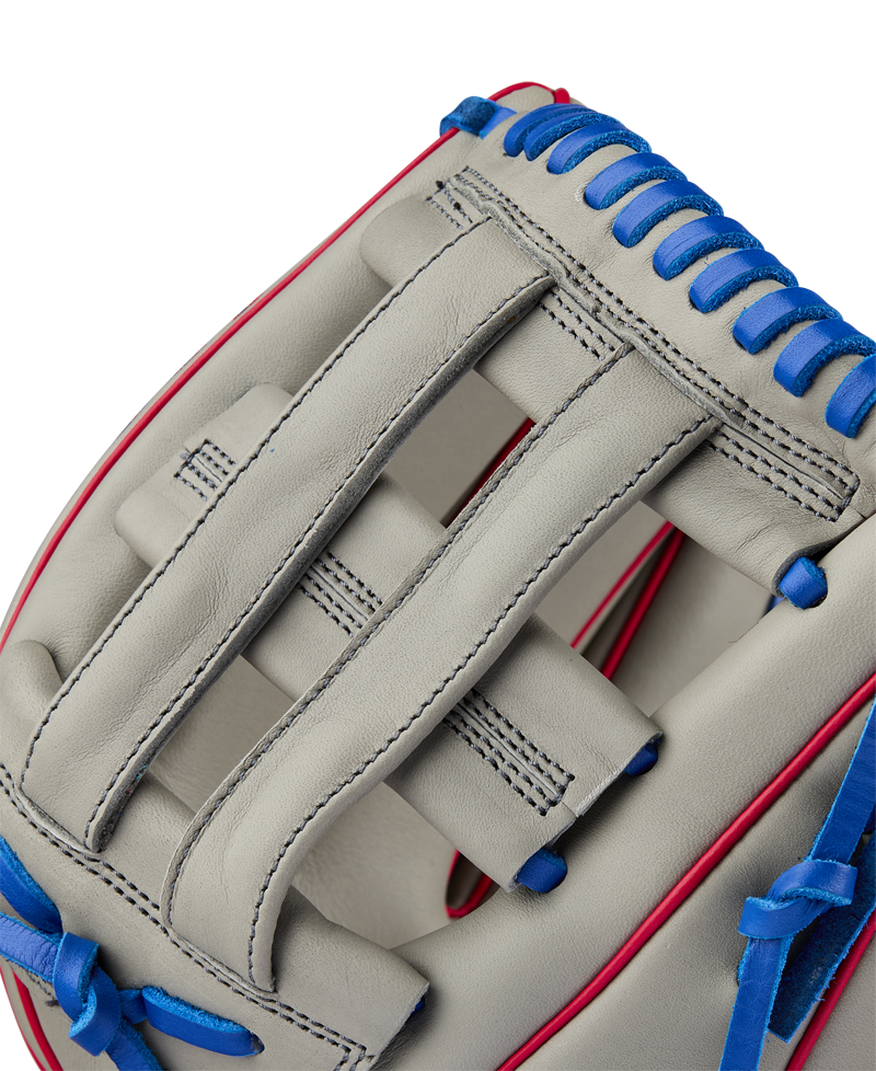 Close-up of the Wilson A900 PF12 12" Baseball Glove (WBW10257112), a light gray youth glove with blue laces, red trim, and detailed stitching—perfect Pedroia Fit utility glove for young players.