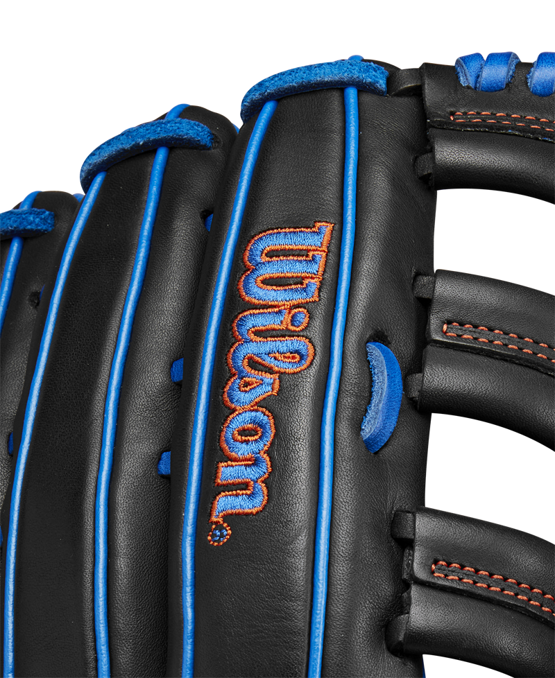 Close-up of the black Wilson A1000 PF1892 12.25" Baseball Glove (WBW1025831225) in Full Grain leather, with blue laces, red stitching, and the Wilson logo embroidered in red and blue.