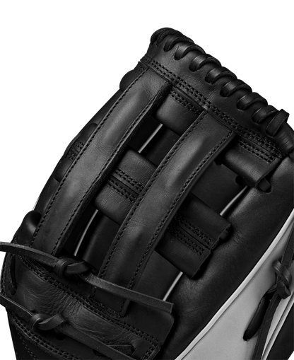 Close-up of the Wilson A1000 1750 12.5" Baseball Glove (WBW102585125) in black and gray Full Grain leather, highlighting its detailed webbing and stitching.
