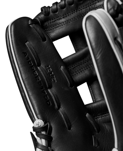 Close-up of the Wilson A1000 1750 12.5" Baseball Glove (WBW102585125), featuring black full grain leather, detailed stitching, and visible embossed text that highlights the glove’s quality craftsmanship.