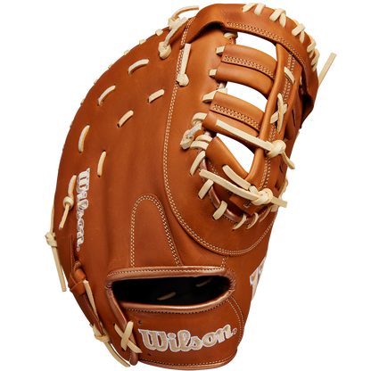 The Wilson A1000 1620 12.5" First Base Mitt (WBW102587125) features full-grain leather, tan laces, an open web, and the Wilson logo stitched in white on the thumb and wrist strap.