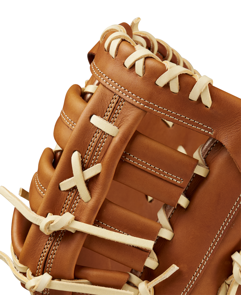 Close-up of the Wilson A1000 1620 12.5" First Base Mitt (WBW102587125) in brown, highlighting detailed white laces and stitching with smooth full grain leather, set against a plain background.