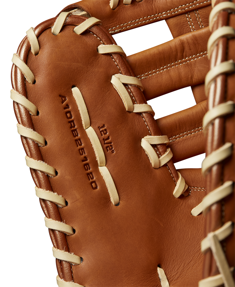 A close-up of the Wilson A1000 1620 12.5" Baseball First Base Mitt (WBW102587125) by Wilson, crafted from full grain leather with cream-colored laces and embossed model details on the palm.
