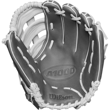 A close-up of the Wilson A1000 IF12 12" Fastpitch Glove (WBW10259112) shows its gray design with white laces, open palm, and webbing. The Wilson logo is embossed near the thumb area.