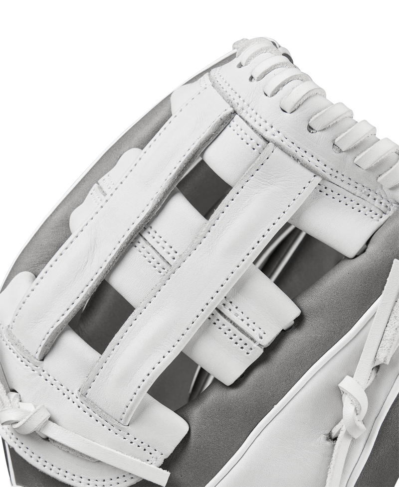 Close-up of the Wilson A1000 IF12 12" Fastpitch Glove (WBW10259112) by Wilson, featuring white full grain leather, detailed stitching, and woven laces—ideal as an infield glove—shown against a plain background.