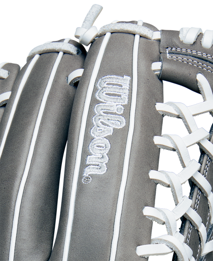 Close-up of the Wilson A1000 T125 12.5" Fastpitch Glove (WBW102596125) in gray, featuring white stitching and laces, full grain leather, and the embroidered Wilson logo on the leather surface.