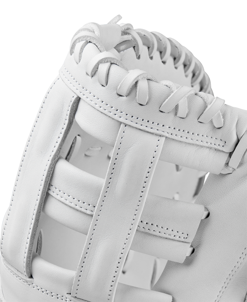 Close-up of the Wilson A1000 1620 12.5" Fastpitch First Base Mitt (WBW102598125) by Wilson, featuring full grain leather, detailed stitching and laces, plus intricate webbing between the thumb and fingers.