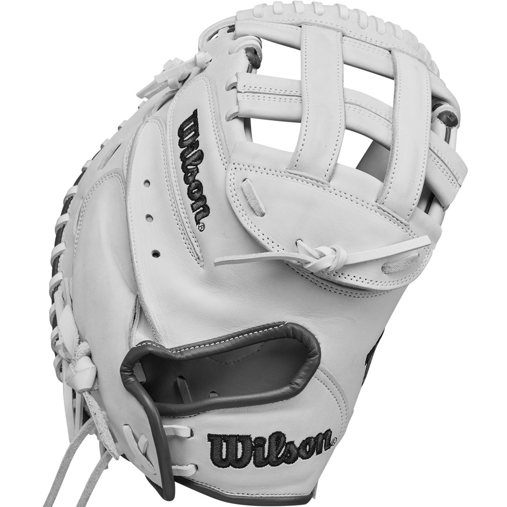 The Wilson A1000 CM33 33" Fastpitch Catcher's Mitt (WBW10260033) features a white design with black stitching, Wilson branding, open web, visible leather lacing, and is made from durable full grain leather.
