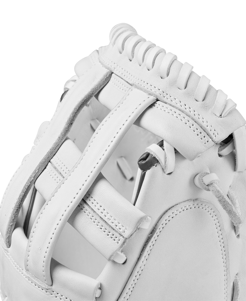 Close-up view of the Wilson A1000 CM33 33" Fastpitch Catcher's Mitt, crafted from full grain leather with detailed stitching, laces, and padding on the webbing and thumb area.