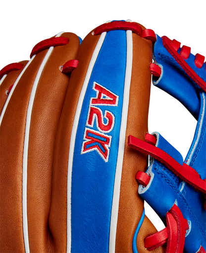 Close-up of the Wilson A2K 1786 11.5" Mookie Betts GM Baseball Glove, featuring select brown leather with blue and red accents, and "A2K" stitched in red and white on a blue panel. Brand: Wilson. Model: WBW102616115 (FALL 2024).