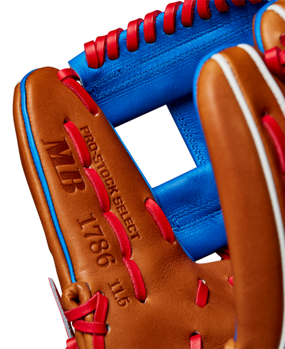 Close-up of the Wilson A2K 1786 11.5" Mookie Betts GM Baseball Glove, crafted from Pro Stock Select leather in brown with red lacing and blue accents. Features "PRO STOCK SELECT 1786 11.5" and MB initials. Model: WBW102616115 (Fall 2024).