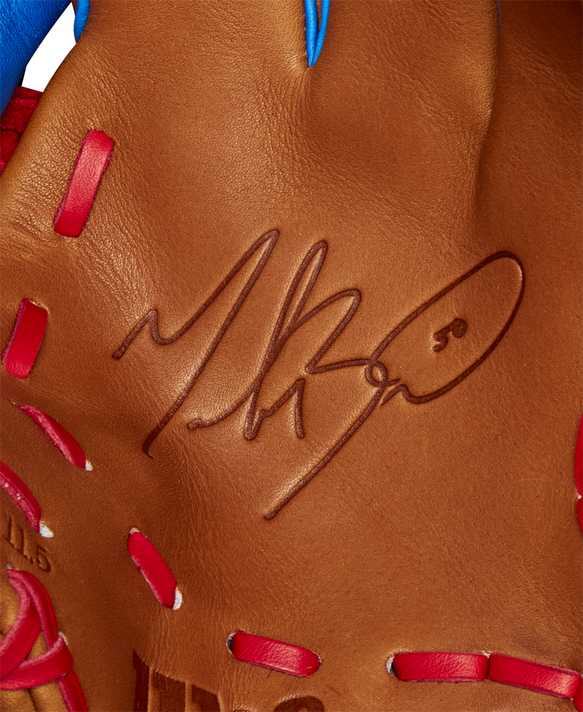 Close-up of the Wilson A2K 1786 11.5" Mookie Betts GM Baseball Glove (FALL 2024), featuring brown Pro Stock Select leather, red stitching, and a black autograph on the palm—similar to those used by Mookie Betts.