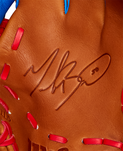 Close-up of the Wilson A2K 1786 11.5" Mookie Betts GM Baseball Glove (FALL 2024), featuring brown Pro Stock Select leather, red stitching, and a black autograph on the palm—similar to those used by Mookie Betts.