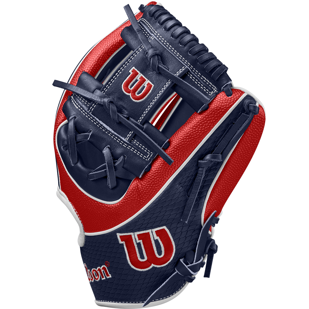 The Wilson A2K 1724SS 11.75" Baseball Glove (FALL 2024) features navy blue and red Pro Stock Select leather, navy SuperSkin webbing and stitching, white accents, and the Wilson logo on the thumb and wrist.