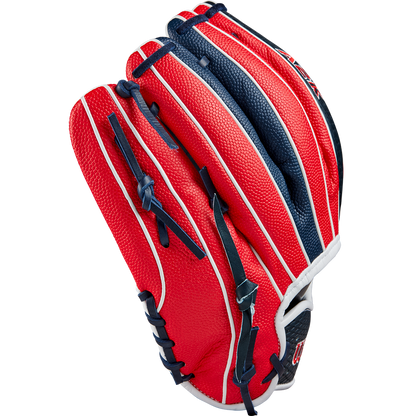 The Wilson A2K 1724SS 11.75" Baseball Glove (FALL 2024) features a red, white, and blue design with Pro Stock Select leather, black laces, and white accent stripes, displayed closed on a light gray background.